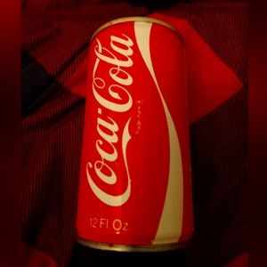 Vintage 1973 coke pull tab can with advertisement for metal serving trays. Empty